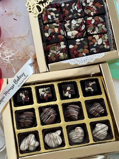 My festive gift boxes, combining assorted chocolates with my popular fruit and nut chocolate bark.