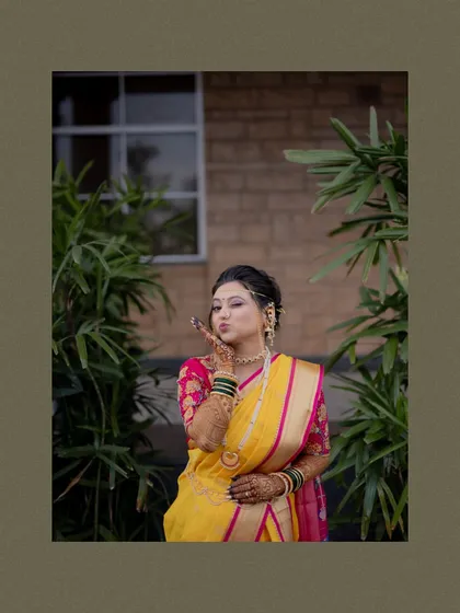 A cute portrait of the bride blowing a kiss to the camera, full of charm and happiness.