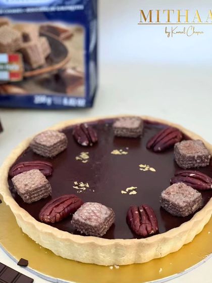 I've combined two favorites into one ultimate tart sensation. A buttery tart shell is filled with my signature chocolate mousse and topped with Loacker wafers and pecans.