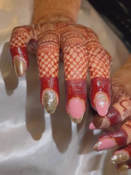 A still shot of the pink and metallic bridal set, showing the contrast between the matte pink, the sparkling silver glitter, and the reflective gold chrome.