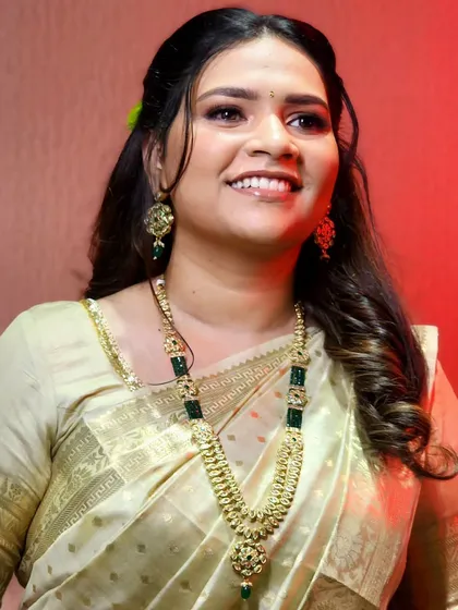 A close-up of the bride's glowing reception makeup. The look is soft, radiant, and effortlessly beautiful.