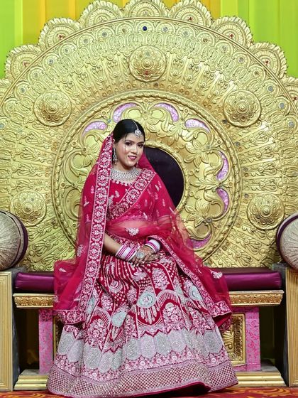 Feel like a queen on your throne in this heavily embroidered pinkish red lehenga. It’s designed to look magnificent whether you are sitting or standing.