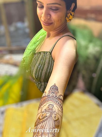 A happy bride showcasing her beautiful arm portrait, a testament to the joy of wearing a personal story.