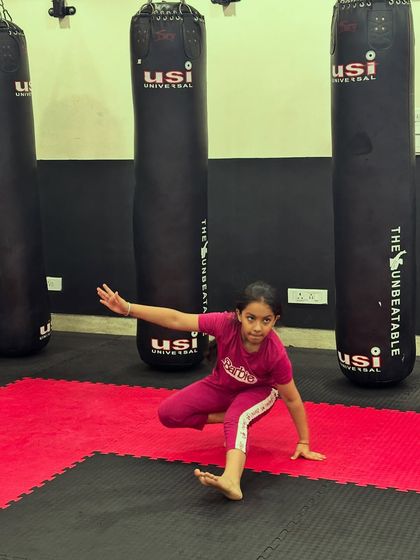 This young student shows off her agility with an animal flow exercise. Our warm-ups are designed to be fun while improving mobility and coordination.