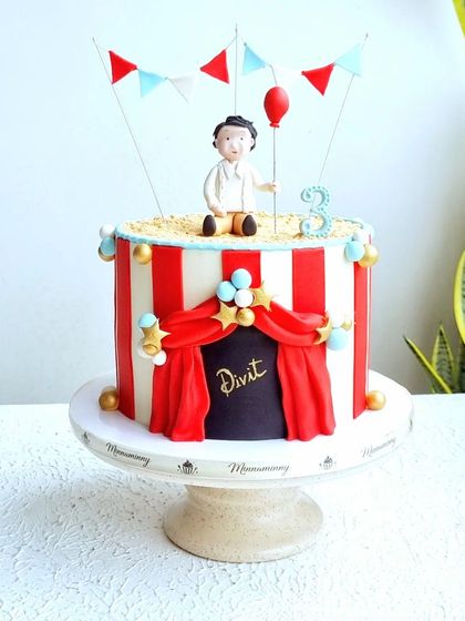 A full view of the red and white striped carnival cake.