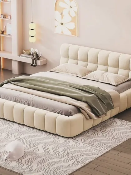 We also provide custom beds, like this luxurious king-size bed with a channel-tufted, oversized headboard and frame. It creates a soft, inviting centerpiece for any bedroom.