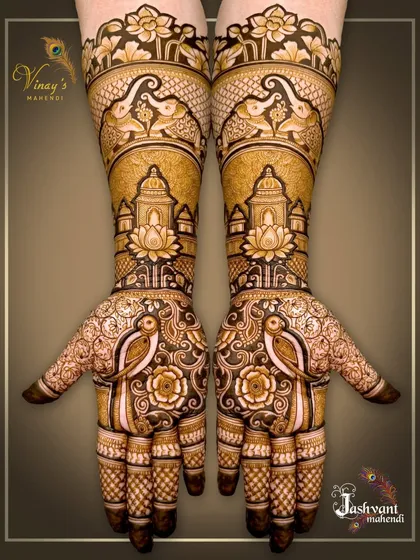 An example of the royal treatment we give to the wedding family. This symmetrical design for the groom's sister features majestic elephants, parrots, and architectural domes, blending traditional motifs with a clean, modern layout.