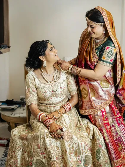 These heartwarming photos show the bride with her parents. I created coordinated, elegant makeup and hair for both the bride and her mother, ensuring everyone felt their best on this special family day.