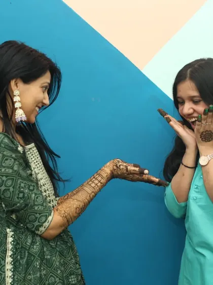 Another fun, unposed interaction during the Mehandi ceremony. These photos capture the true spirit and excitement of the day with friends and family.