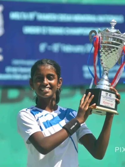 A smile of a national-level competitor. Trisha proudly holds her trophy after the U12 Ramesh Desai Memorial Nationals, one of the most important tournaments for juniors in India.