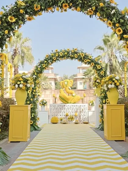 Making a grand statement is easy with a series of sunflower arches. This entrance I designed for a Haldi event creates a beautiful, immersive walkway for guests, leading to a Ganesha statue made entirely of marigolds.