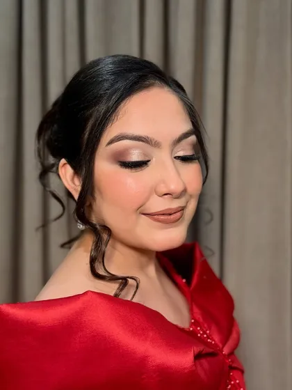 Eyes closed to showcase the beautiful, soft-smokey eye makeup, a versatile look for any party.