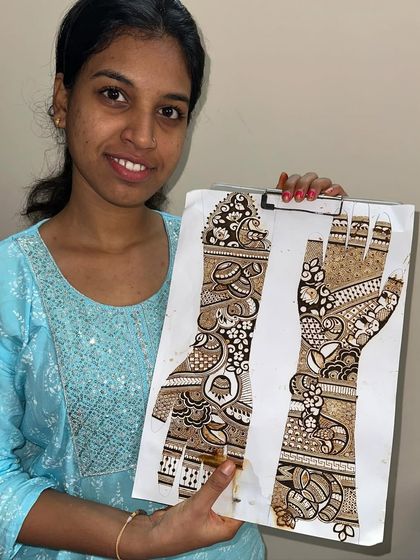 Another student showing her beautiful work from our professional bridal mehandi class. Her skill in creating balanced and detailed designs is clearly visible.