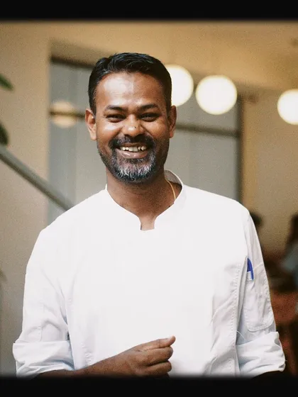 A portrait of our smiling chef. The passion of our team is a huge part of the Paper & Pie experience.