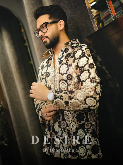 This shot captures the unique texture and refined look of the crochet-style shirt, a piece for the man with a keen eye for detail.