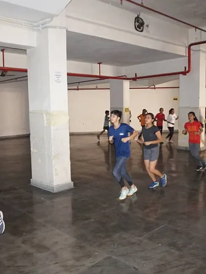 A warm up jog around the training hall. Every session begins with exercises designed to increase heart rate and prepare the muscles for the demanding workout ahead.