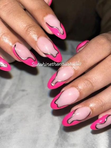 A bold and beautiful set with hot pink and silver chrome abstract French tips.