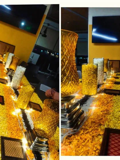 The office cafeteria was decorated with long tables covered in marigold petals and lit with fairy lights. This simple but effective decor transformed the everyday space into a special place for celebration.