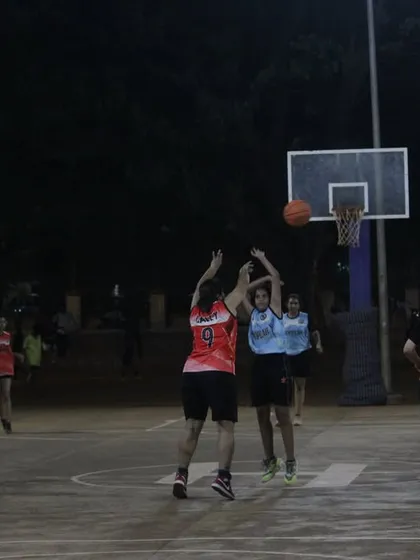 Intense action under the basket during a women's semi-final game. Both teams are fighting hard for a spot in the finals.