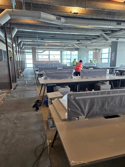 This image shows a large, modern office floor before final setup. Applying Vastu at this stage ensures the company starts its operations in a positive and supportive environment.