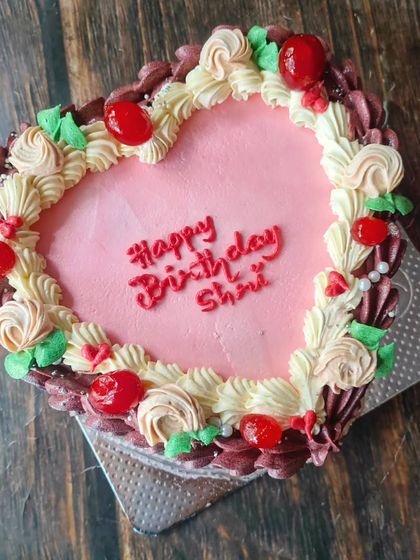 I finally made one of these ornately decorated vintage heart cakes. It's one of the few designs where more is more, with intricate piping, rosettes, and cherries.