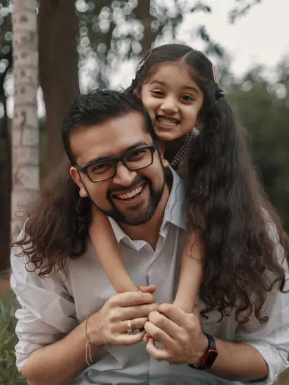 The bond between a father and daughter is a love story that lasts a lifetime. Capturing their shared laughter during a piggyback ride is a perfect example of the happy, authentic moments I live to photograph.