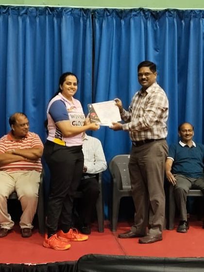 Kushi V on the podium as the Women's Singles Runner-Up at the Karnataka State Ranking in Mysore.