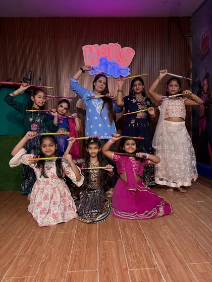 A group photo of our young Garba dancers with their instructor. It shows the fun, supportive learning environment we create for our students to thrive in.