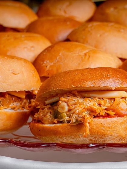 Our delicious chicken sliders are a perfect bite-sized snack for any party, filled with flavorful shredded chicken.