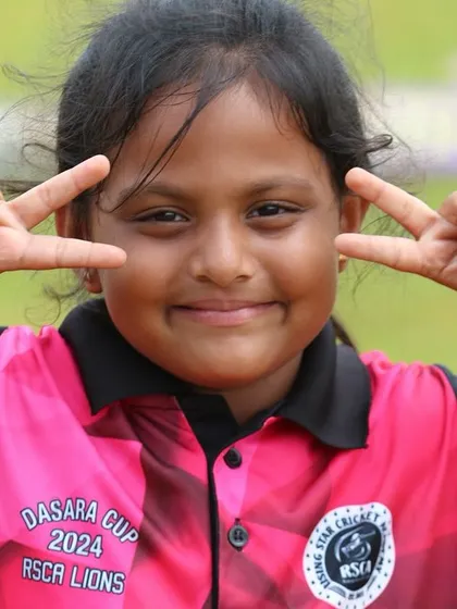 The pure joy and fun of cricket, captured in the smile of one of our youngest players.