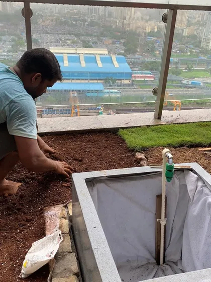 Here’s a look at the installation process for a terrace garden. I am preparing the soil bed next to a custom-built liner for a water feature. Proper groundwork is key to a healthy, long-lasting garden and a leak-proof water system.