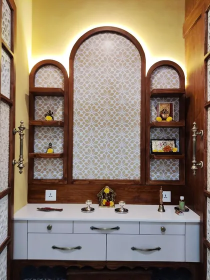 A sacred space for prayer and reflection, this custom pooja room is a testament to intricate craftsmanship. Featuring ornate jaali work, warm ambient lighting, and dedicated storage, we designed this space to be a tranquil sanctuary within the home.