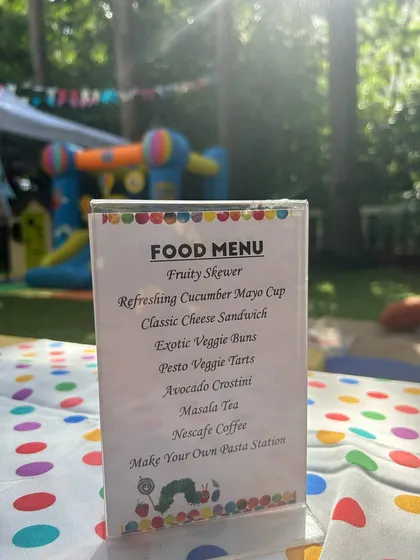 A close-up of the custom food menu for a themed birthday party. I work with you to create a menu that fits your theme and includes kid-approved favorites like a "Make Your Own Pasta Station."