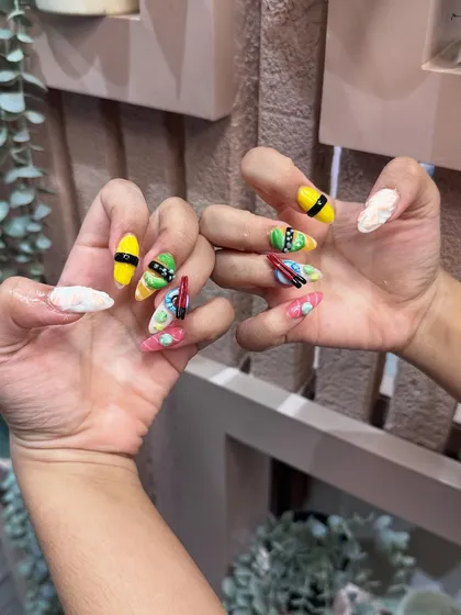 The complete sushi set against our studio's calming backdrop. Fun, quirky, and expertly crafted 3D nail art is what we do best.