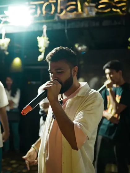 Another artist takes the mic, contributing to the non-stop flow of talent at our Insync Hip Hop Project event. The atmosphere is always electric and full of creative energy.