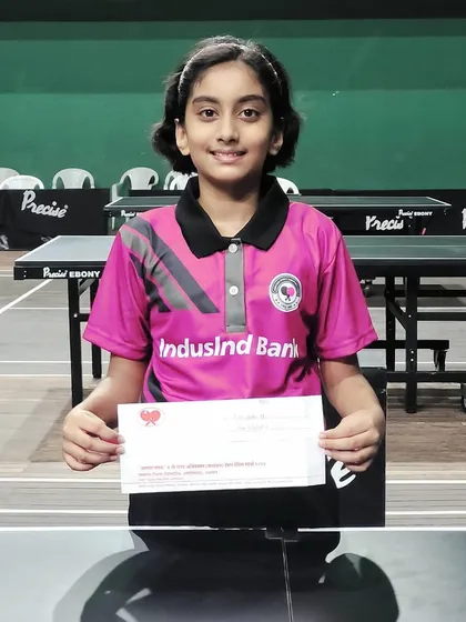 Mahika Susvirkar proudly holds her prize after winning her first state-level bronze medal in the under-11 category at the 4th Maharashtra State Ranking in Jalgaon.