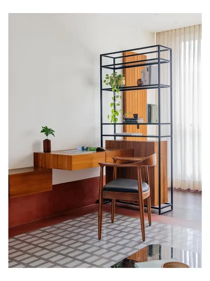 A custom armchair with a leather seat, part of a study nook I designed. The chair's form is both ergonomic and elegant, crafted from solid wood to provide a comfortable and stylish place to work.
