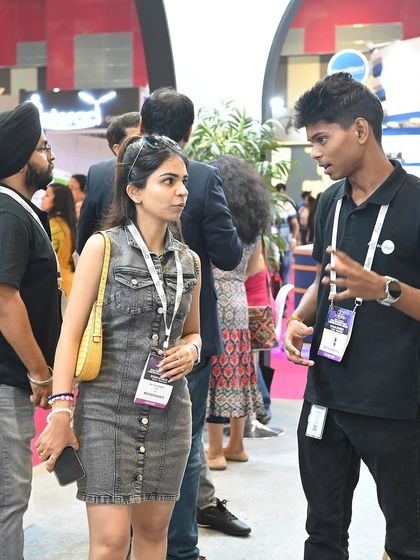 A member of our technical team explaining the intricacies of a system to an engaged visitor. These one-on-one conversations are where we can truly share the value and potential of smart home technology.