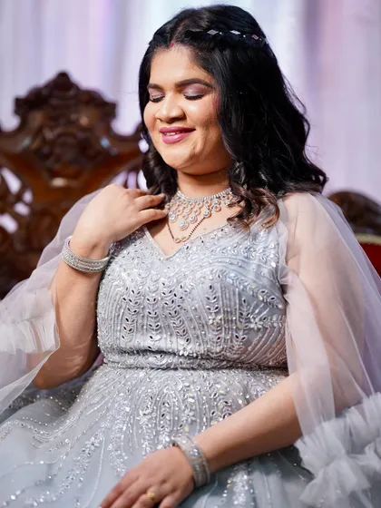 A lovely seated portrait of my client for her anniversary. The soft makeup and diamond jewelry pair beautifully with her silver gown.