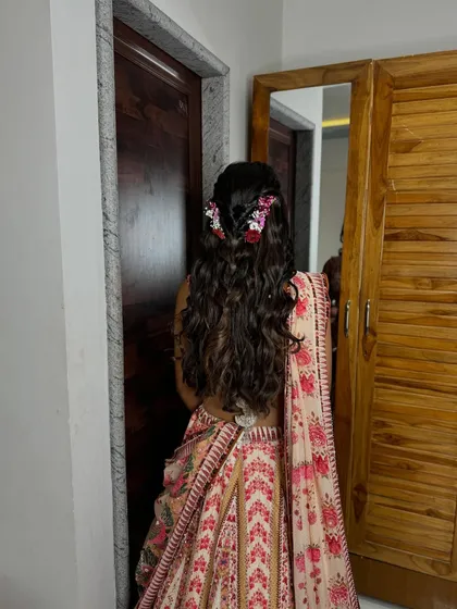 The detail of the floral arrangement in this beautiful, soft hairstyle.