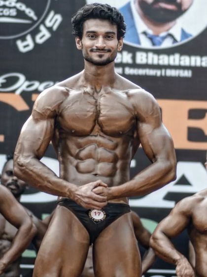 Holding a strong front pose in the lineup. Confidence and a powerful stance are just as important as the muscles themselves.