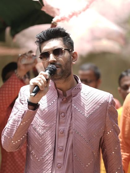 A close-up shot while interacting with the crowd. My style is always interactive, ensuring everyone feels like a part of the jashn.