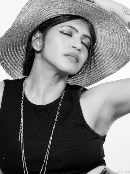 A black and white beauty shot, with the model's eyes closed, creating a serene mood.