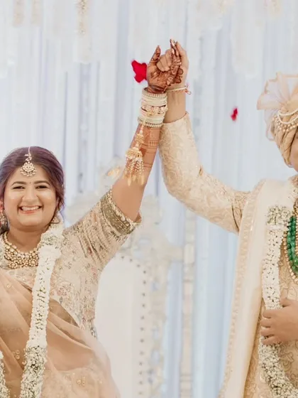Sealing the deal with a cheer. This joyful photo captures the excitement of being officially married, a moment of pure celebration.