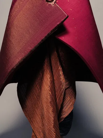 A detail shot of the sculptural Kanjivaram drape, showing how the rich texture of the silk holds its shape. This was an experiment in treating the saree as a wearable art form.