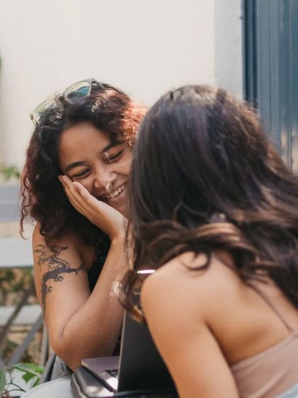 A candid moment of friends sharing a laugh at our cafe. We love being the backdrop for your happy memories.
