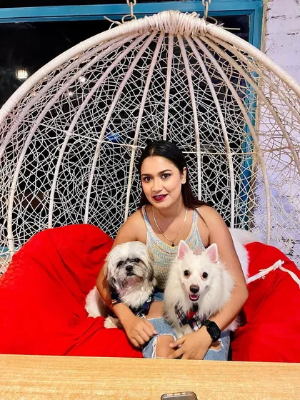 Posing for the camera on her birthday! It's a joy to see families, including their furry members, come together to celebrate milestones at Bark Street.