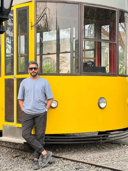 Posing by a cool yellow tram, a great prop I found for a shoot location.