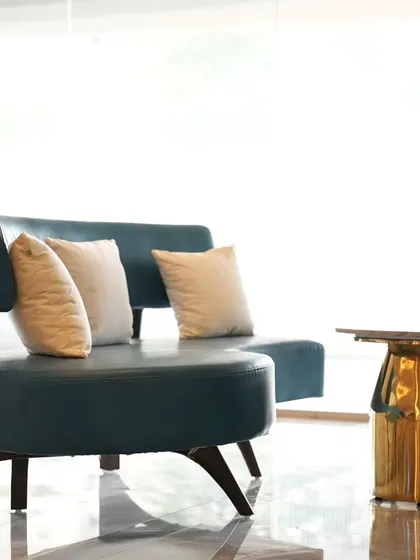 This photograph focuses on the elegant, modern furniture within a brightly lit commercial space. I used the natural light from the large windows to emphasize the sleek curves and design of the seating, creating a clean and high-end look for this architectural photography project.