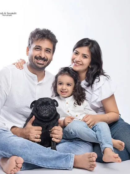 Your furry friends are part of the family, and we love including them. This studio family portrait, or 'pawtrait', captures the complete, happy crew.